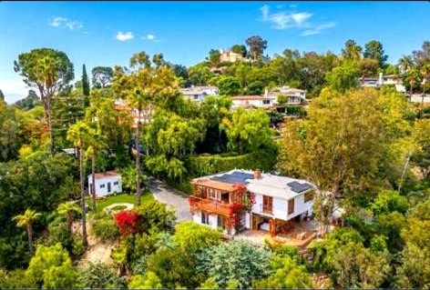 Aerial view of the WRT sanctuary house tucked into the green Woodland Hills